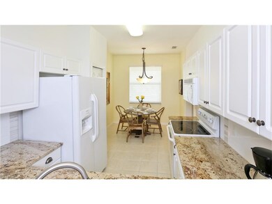 The nicely updated kitchen is modern, neutral and 