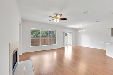 Unfurnished living room featuring a fireplace, ce