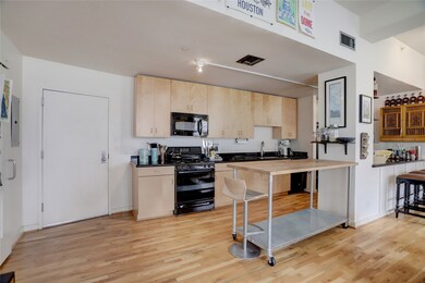 Entry to the unit and kitchen. The washer & dryer