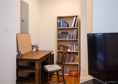 This office NOOK is located just off the living room, adjacent to the second bedroom. It's a great flexible space for work, reading, or additional storage shelves.