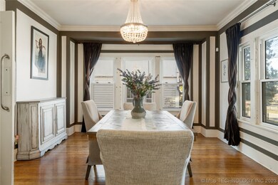 The formal dining room is just off the foyer, next