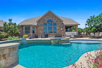 View of pool with a patio area, a pool with conne