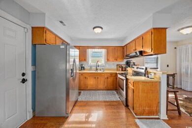 Kitchen featuring stainless steel appliances, a pe