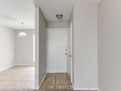 Front door entry with closet next to Dining Room
