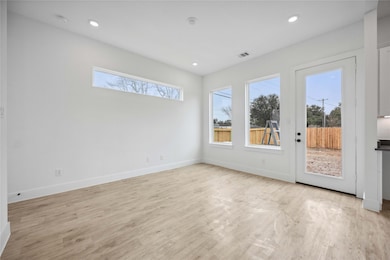 Recessed lights compliment the open first floor li