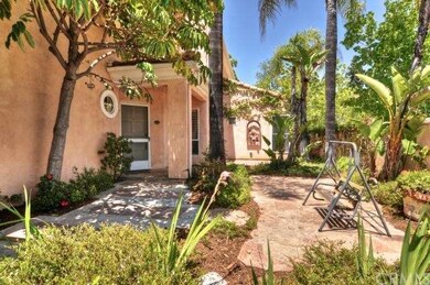Inviting enclosed courtyard with tropical foliage 