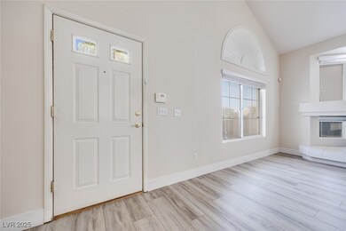 Foyer entrance with wood finished floors, baseboar