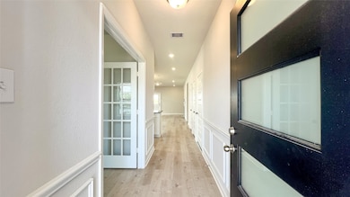 The Kettering II- Foyer into Study with French Doors