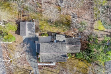 Overhead shot showing the fenced yard, natural pla