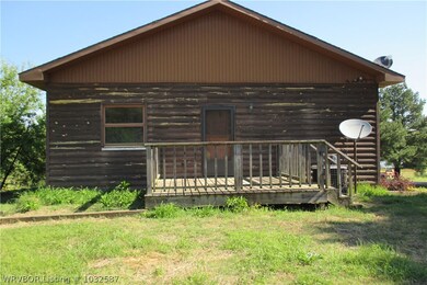 REAR OF HOME. SMALL DECK FOR GRILLING.