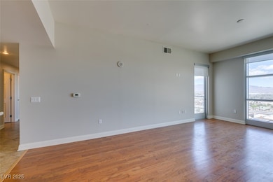 Spare room featuring light wood-type flooring and