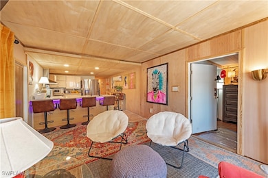 Living area with wood ceiling and wood walls
