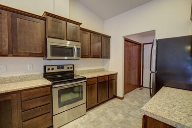 MAPLE CABINETRY, STAINLESS WHIRLPOOL APPLIANCES