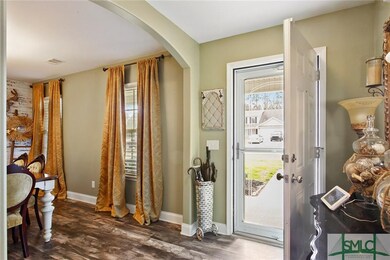 Front entry way and foyer with shiplap flooring.