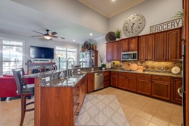 Open Kitchen (20x15), Tile Flooring, Classic Wood Cabinets, Under Cabinet lighting, Granite Countertops, Deep Sink w/Sprayer,  Stainless steal appliances, Double Oven, Gas Cooktop, built in microwave, garbage disposal and a large pantry.