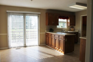 Spacious Kitchen - Utility room offers built in cabinetry conveniently located off the kitchen.