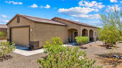 View of front of home featuring stucco siding and