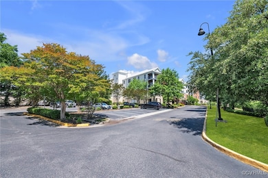 View of asphalt street featuring curbs and street