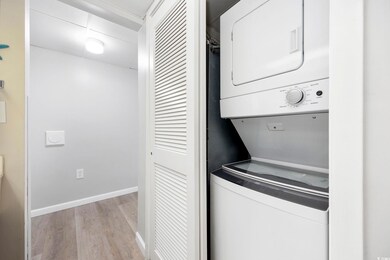 Laundry room featuring light hardwood / wood-style