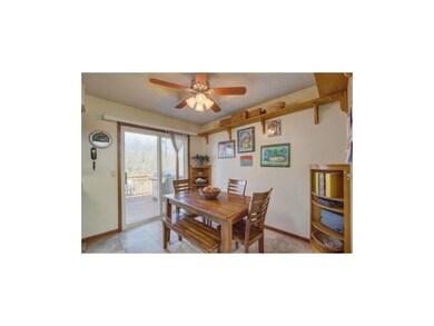 Newer storm door opens to 3 tiered deck.