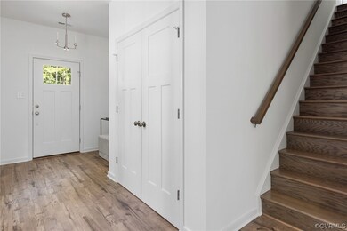 Entrance foyer with hardwood flooring