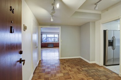 Entry to the unit at dining area. Kitchen to the r