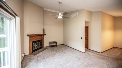 Living Room has high ceilings and gas fireplace