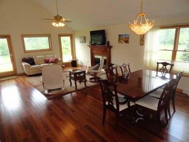 Great Room Brilliant mahogany floors, a vaulted ce