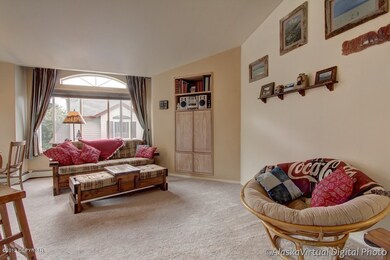 Living room w/vaulted ceiling &