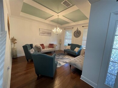 Living Room with a lovely tray ceiling!