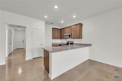 Please Note: These interior photos are not of the actual home but are of a completed one with a similar floor plan. Finishes, features, and layouts may vary.