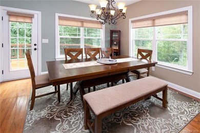 Large eating area open to living room and kitchen.