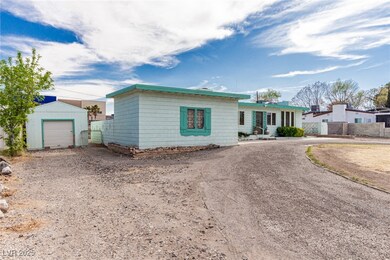 Ranch-style home featuring a shed, an outbuilding,