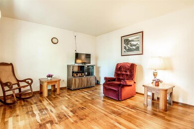 Spacious Living Room featuring hardwood floors.