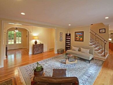 Gracious Living Room Open to Kitchen and Hearthroo