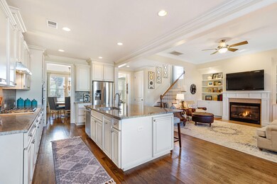 Gas burning fireplace off kitchen