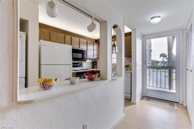Efficient galley kitchen houses the washer and dry