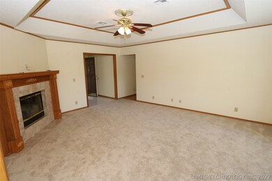 Living with fireplace, new carpet and raised ceili