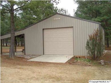 30X30 BARN WITH CONCRETE FLOORS AND ROLL UP DOORS ON FRONT AND BACK