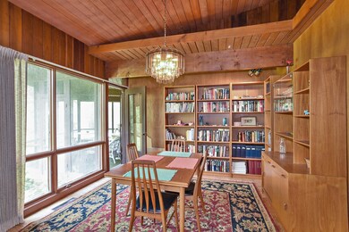 floor to ceiling windows overlooking expansive bac