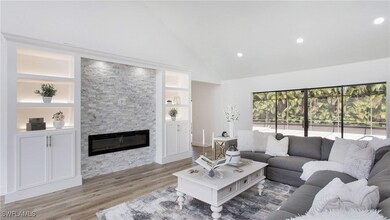Living area featuring a fireplace, light wood-styl