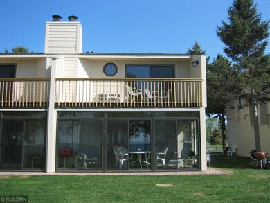 View of back of corner unit town house at 8418 Tux