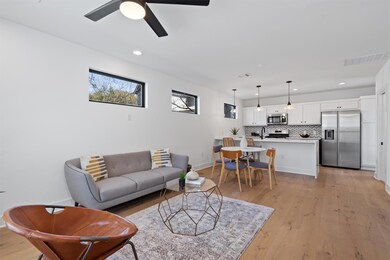 Living room with recessed lighting, light wood fi