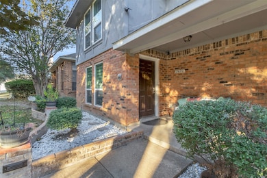 Entrance to property with brick siding