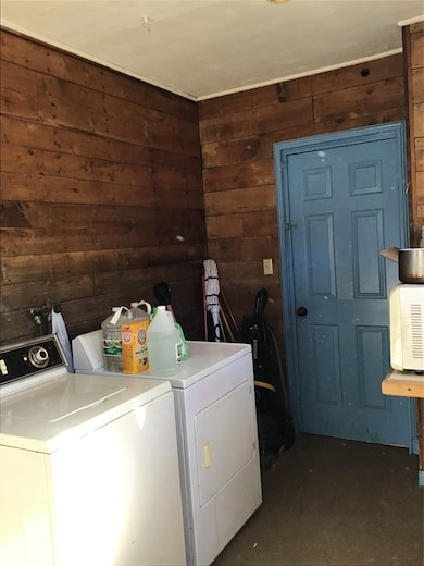 laundry area and door to garage