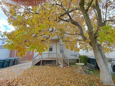 Rear view of house featuring a deck