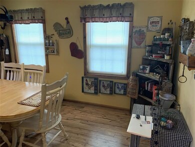 Dining area featuring wood-type flooring and a hea
