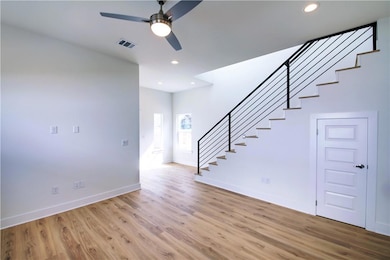 Unfurnished living room featuring visible vents, 