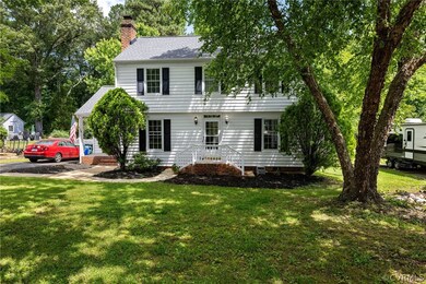 Colonial inspired home with a front yard