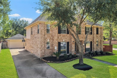 A stately classic design style with detached garage, offers ample parking!  The 2-car detached also boasts a 5ft extension offering extra storage space!